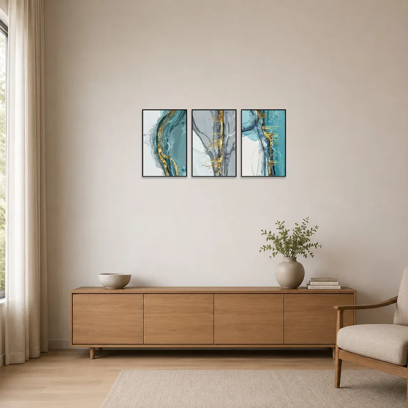 Minimalist room featuring an elegant gold-accented abstract triptych.