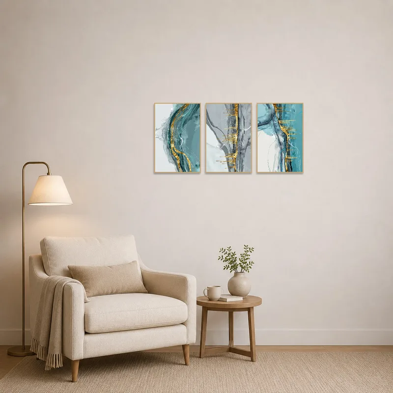 Reading corner adorned with a triptych showing elegant gold abstract elements.