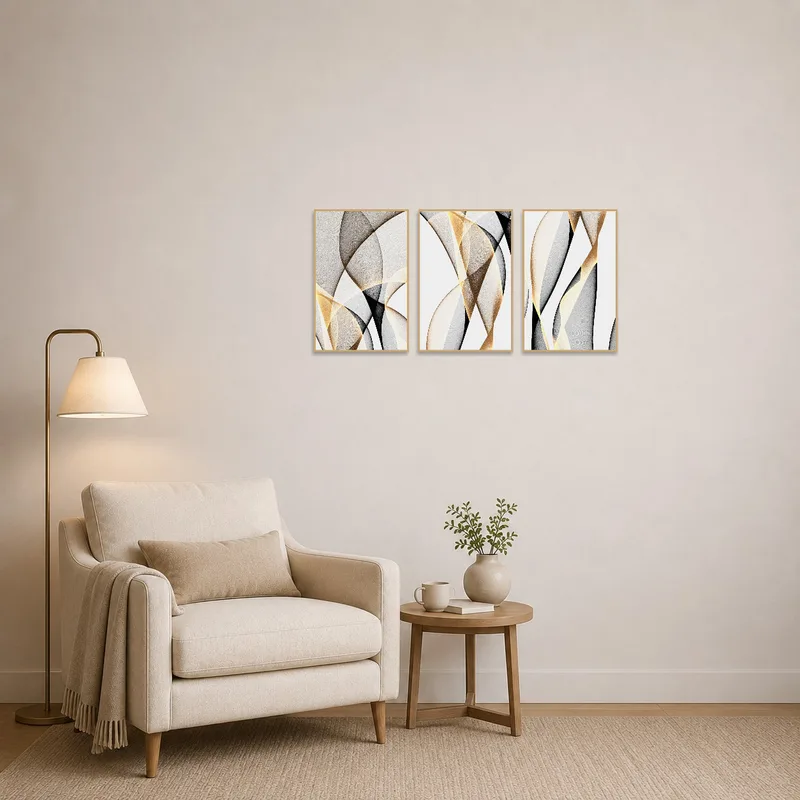 Elegant abstract triptych in a reading corner, providing a serene backdrop with flowing forms.