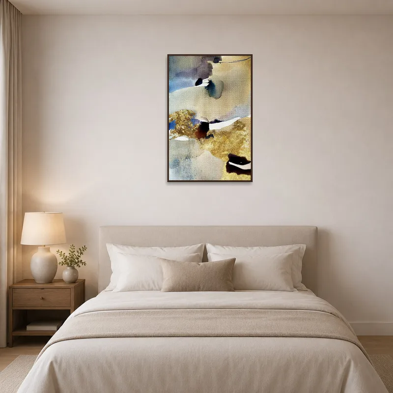 Elegant abstract watercolor with gold accents brings charm to a bedroom decor.