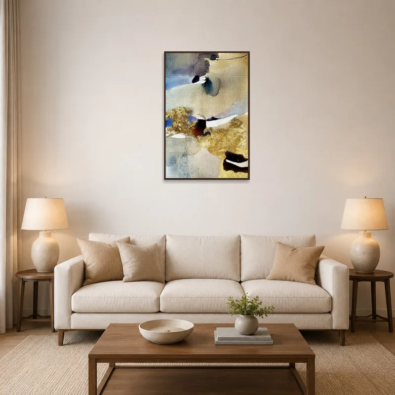 Elegant abstract watercolor with gold accents adds sophistication to a living room setting.