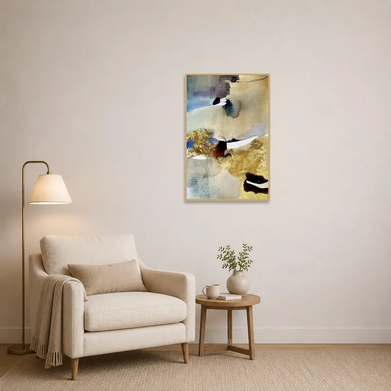 Reading corner enhanced by an elegant abstract watercolor with gold details.