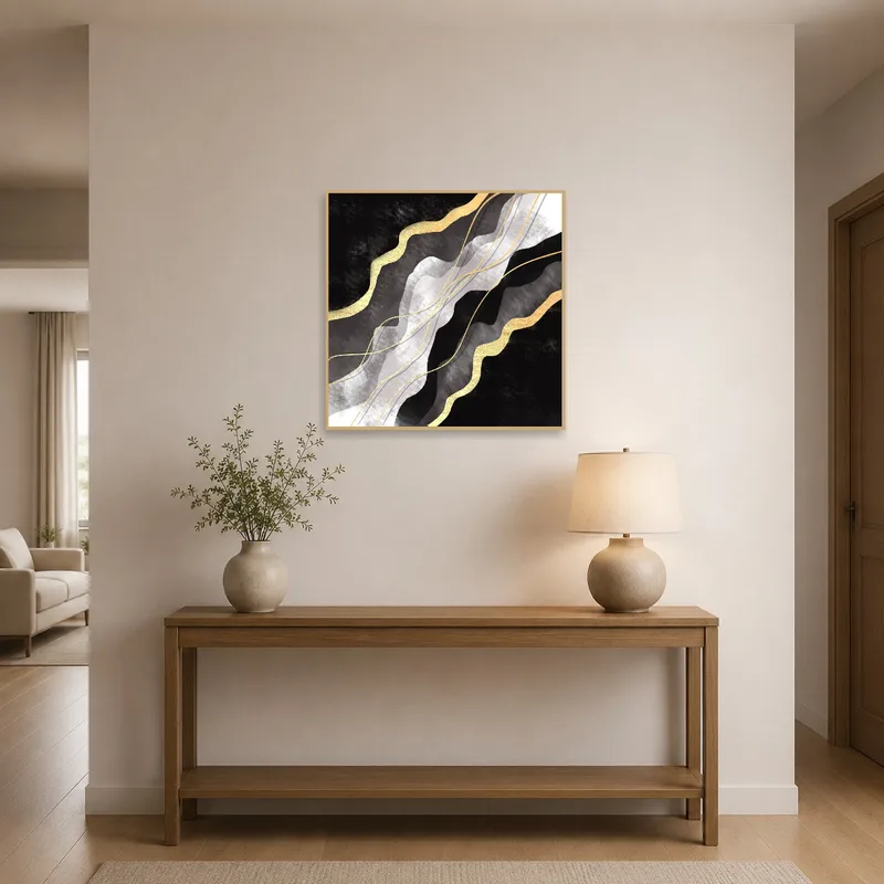 Abstract art with gold details adorning the entrance hall, welcoming guests.