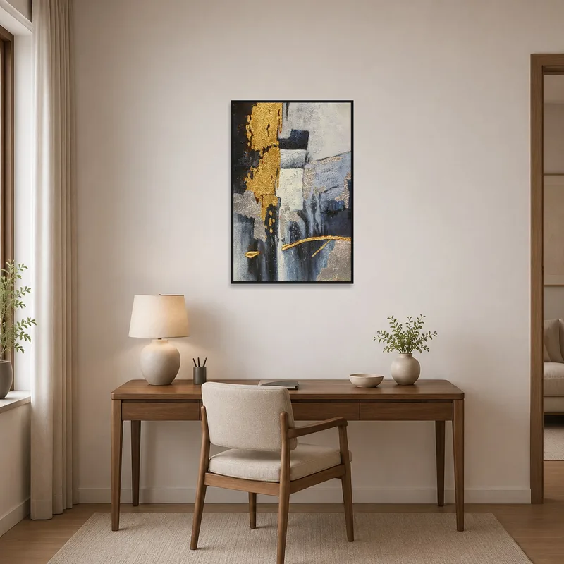 The home office is enhanced by the elegant abstract artwork with its striking gold and silver textures.