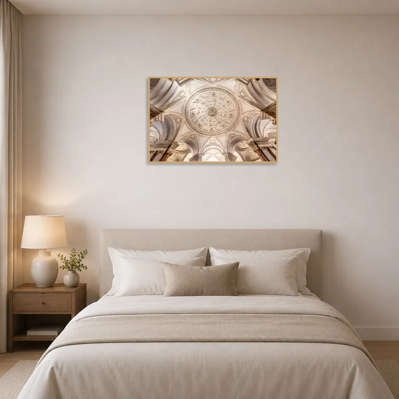 A calming print of a detailed ceiling design is showcased above a chic bedroom headboard.