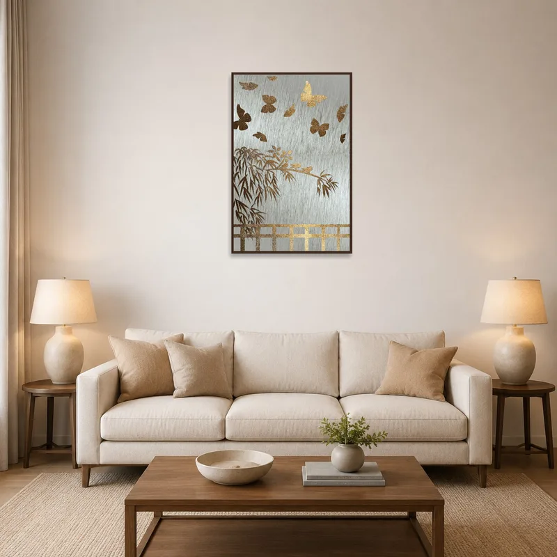 Gold art print of bamboo and butterfly on a living room wall with cozy seating.