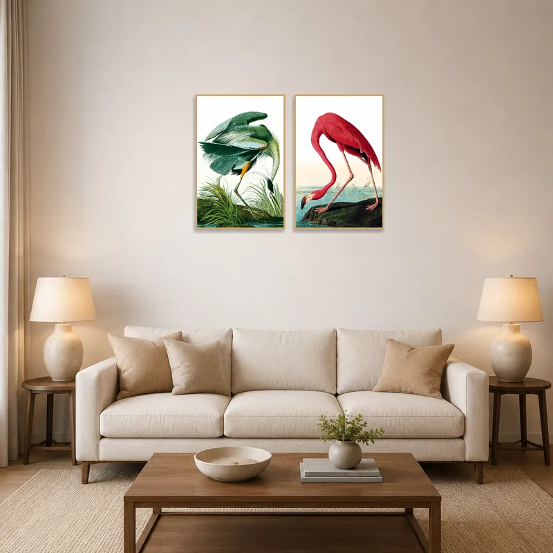 Set of heron and flamingo illustrations hangs in a stylish living room.