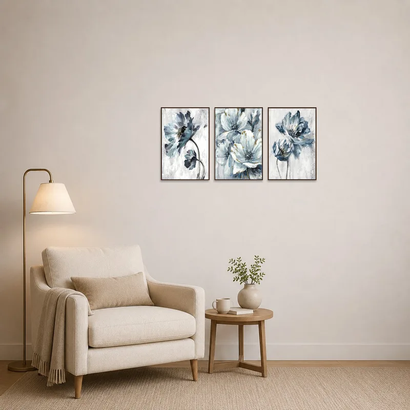 Elegant Blue Floral Vertical Triptych Print Set adding charm to a cozy reading nook with a plush chair.