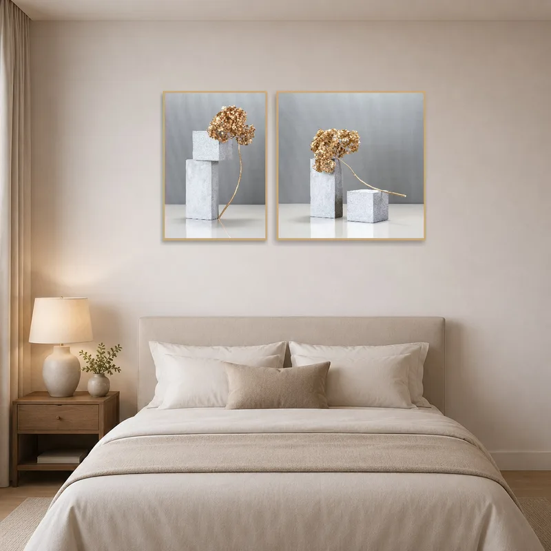 Gray and gold botanical art brings sophistication to a tranquil bedroom setting.