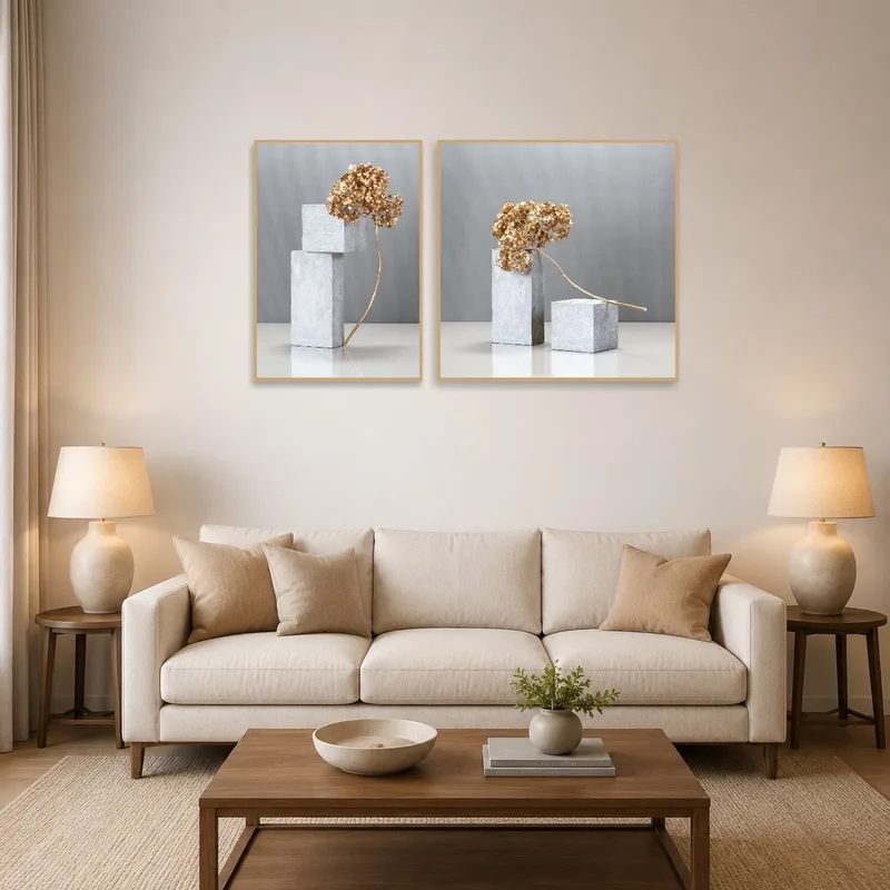 Gray and gold botanical sculpture art on living room wall above a modern sofa.