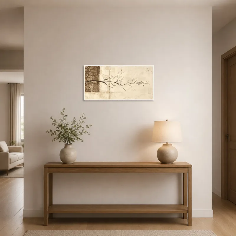 Branch silhouette art welcoming guests in a chic, well-lit entrance hall.
