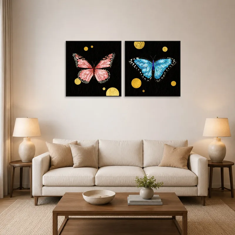 A set of butterfly prints with gold accents displayed over a modern sofa in the living room.