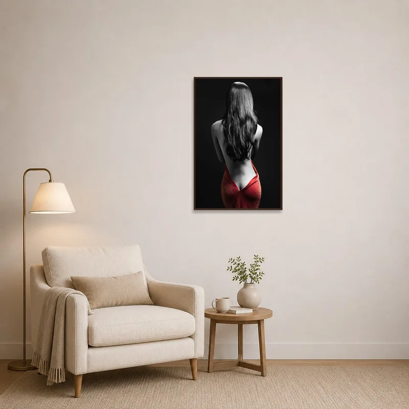 A reading corner adorned with an elegant red and monochrome artwork.