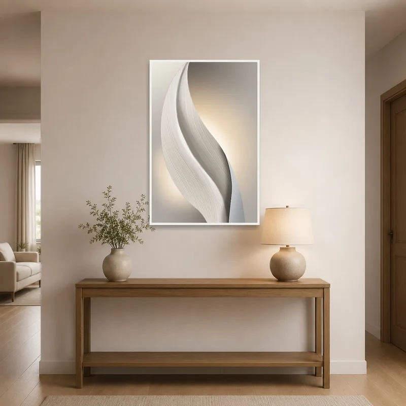 Curved abstract art gracefully hung in a modern entrance hall.