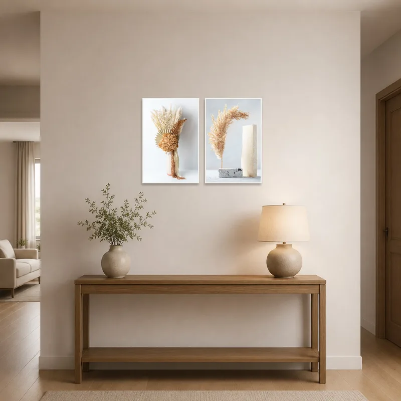 Elegant dried floral prints welcoming guests in a bright, airy entrance hall above a console.