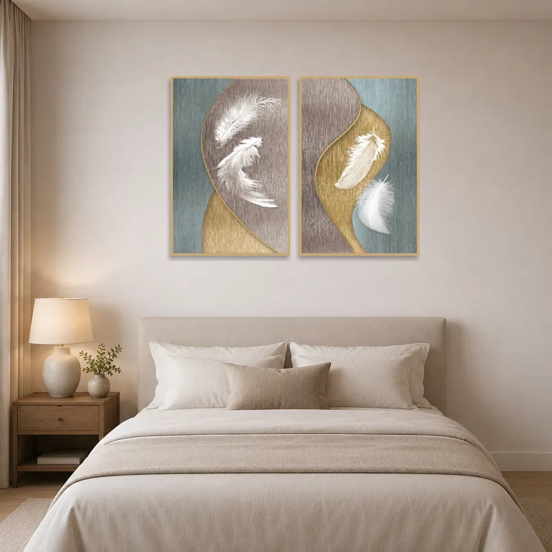 The feather artwork set creates a calming ambiance in the bedroom.