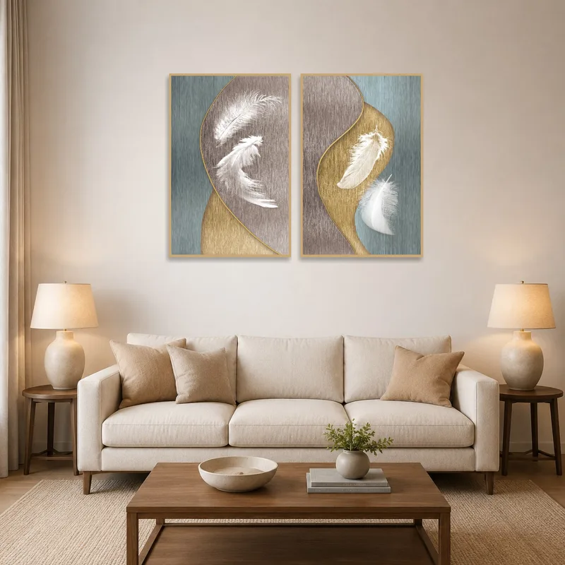 Elegant dual feather art set displayed above a contemporary living room sofa.