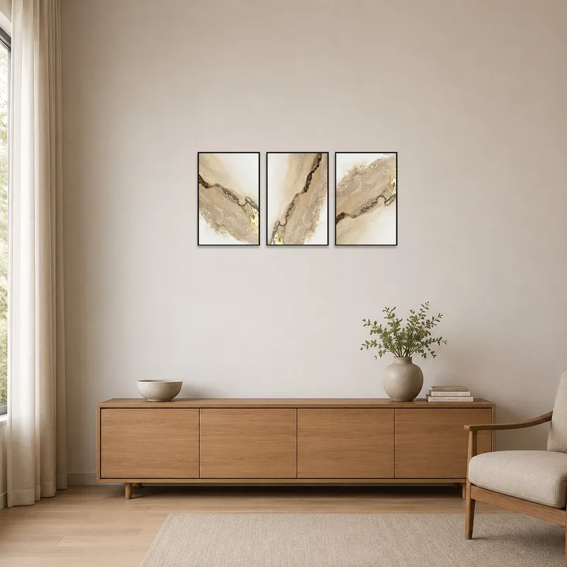 Set of three abstract panels with earthy hues in a minimalist space.