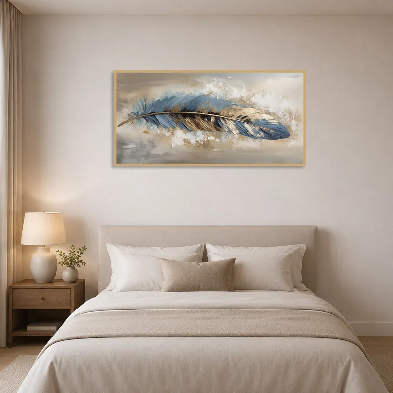 Blue and gold feather art adding elegance to a stylish bedroom.