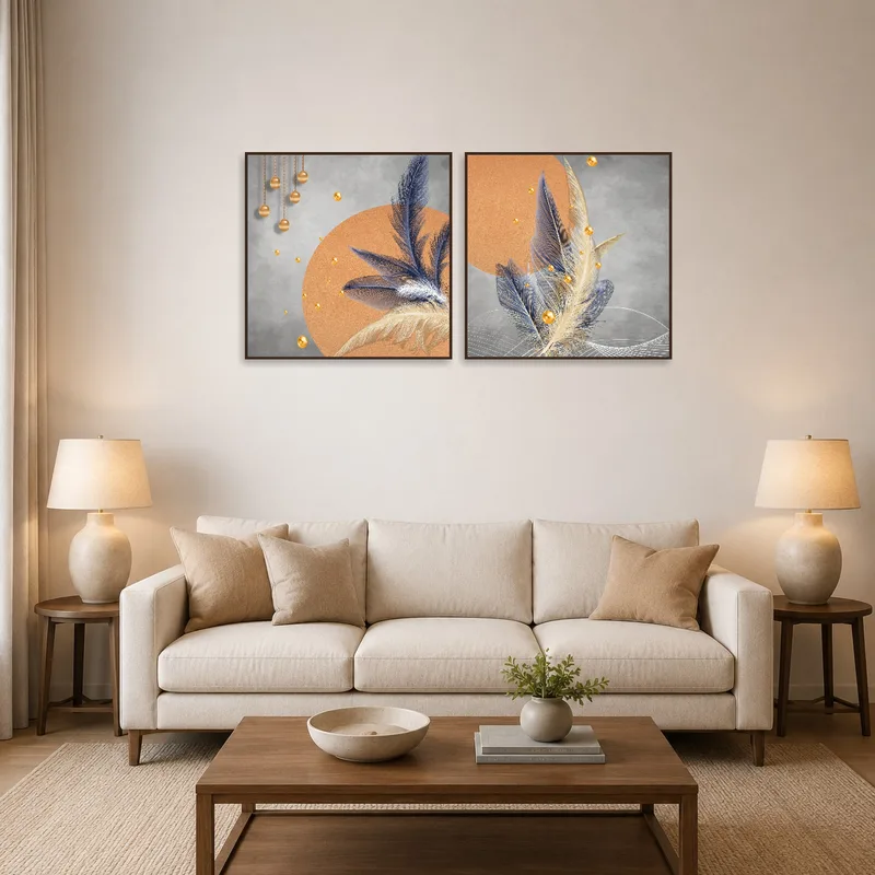 A sophisticated feather and abstract gold artwork set adds elegance to the living room wall.