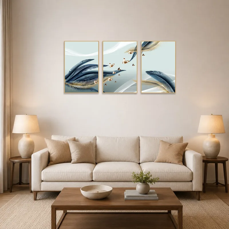 The triptych art of feathers and butterflies adorns a stylish living-room wall.