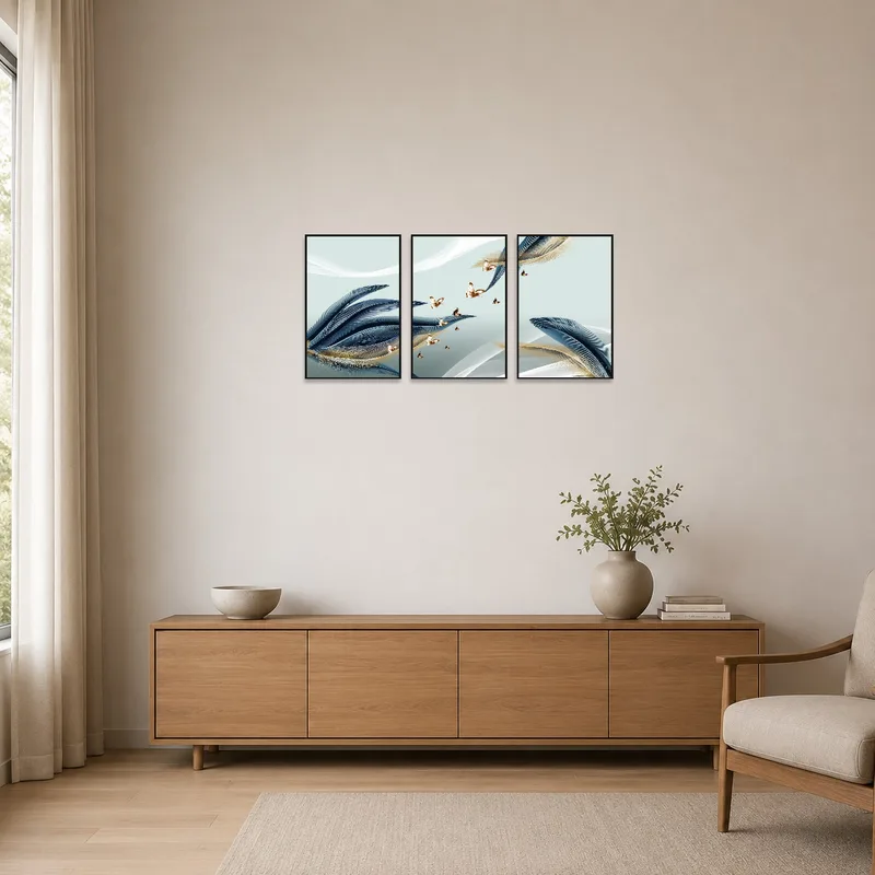 Elegant feather and butterfly triptych set in a minimalist room setting.