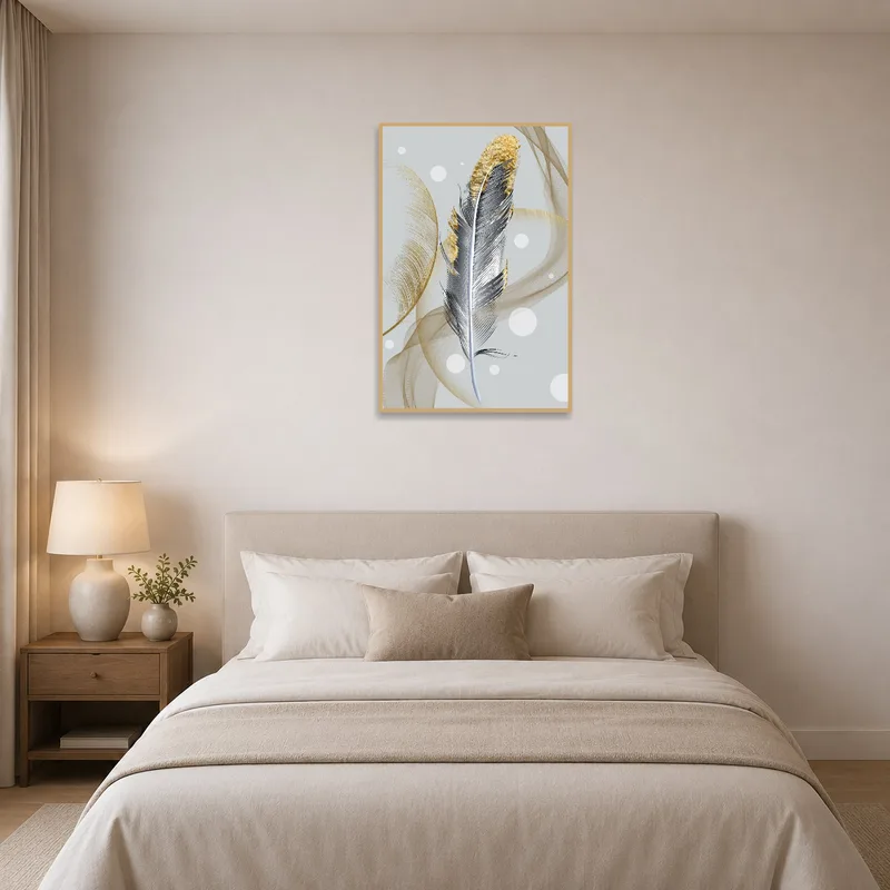 A bedroom with an elegant feather artwork featuring abstract gold highlights.