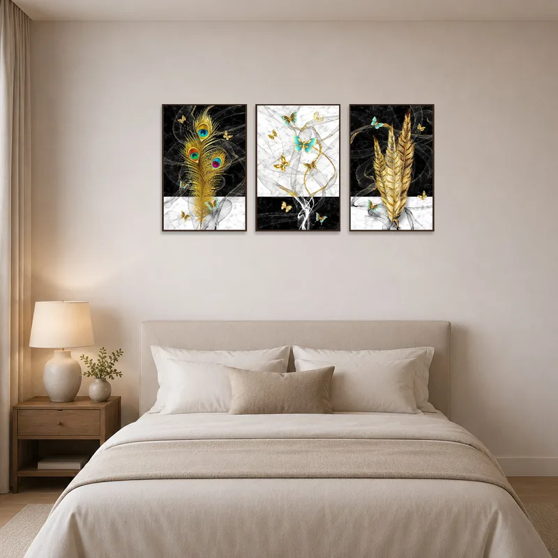 Elegant feathers and butterflies art set adding charm to a bedroom.