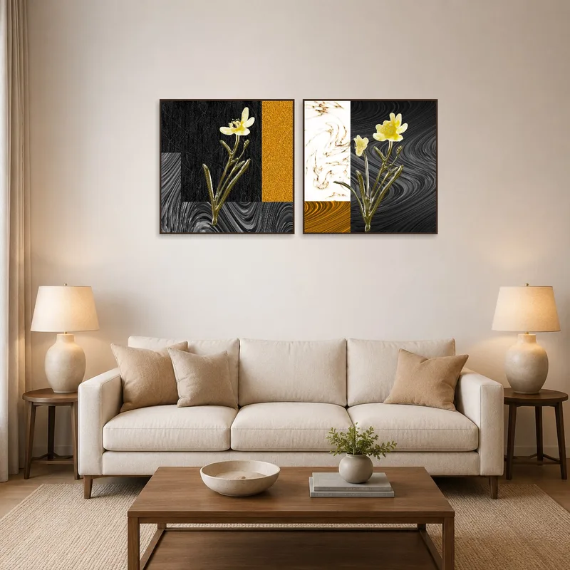 Abstract floral art set with golden tones brightens a modern living room setting.