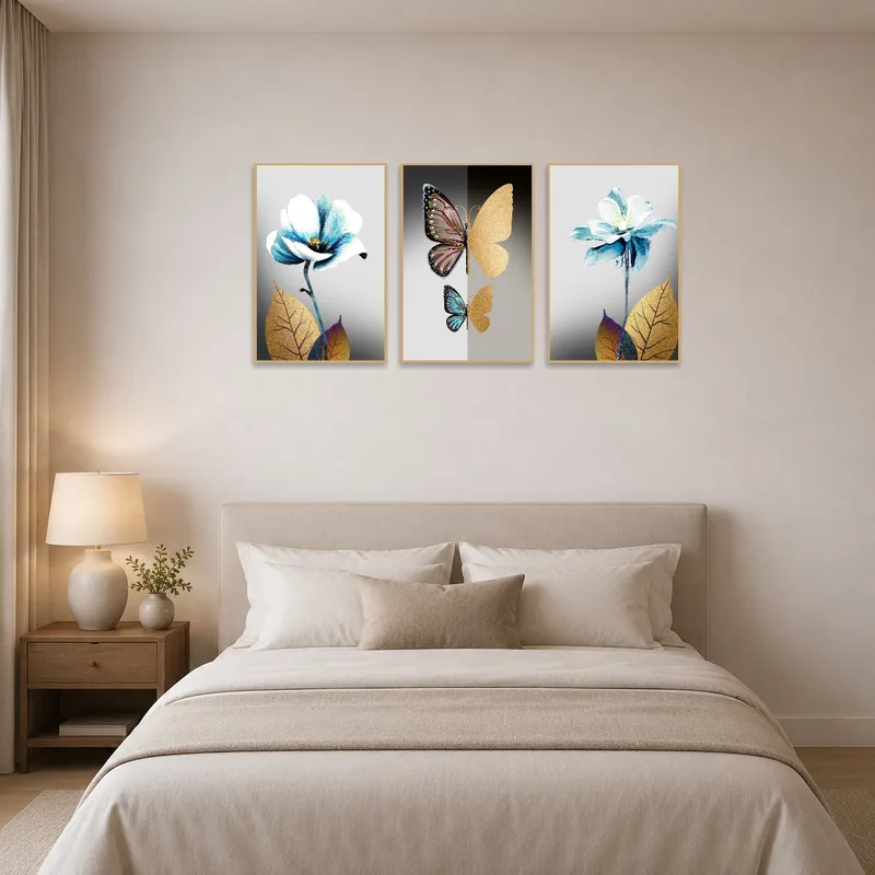 Floral and butterfly triptych adding charm above a bedroom headboard.