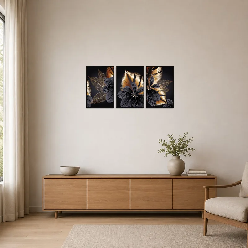 Minimalist room featuring a floral and leaf abstract triptych on a white wall.