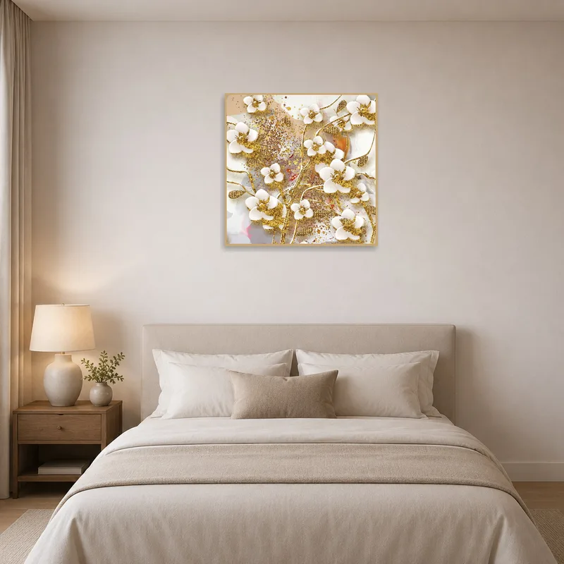 Floral art with gold highlights enhances the tranquility of the bedroom.
