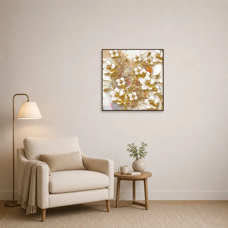 Gold-accented floral art creates a calming atmosphere in a reading corner.