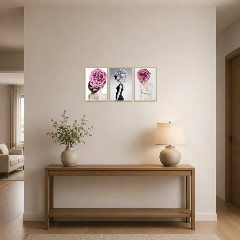 Elegant floral head montage trio displayed in an entrance hall over a console table.