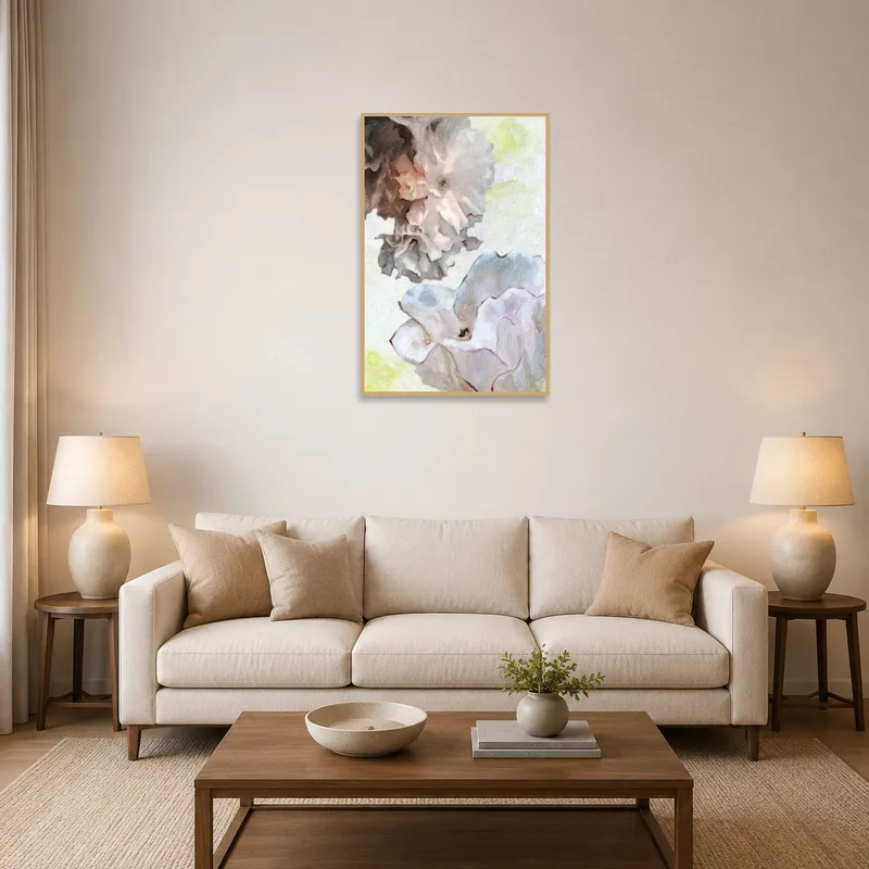 Wall art of elegant floral impression in a soft pastel palette graces a stylish living room wall.