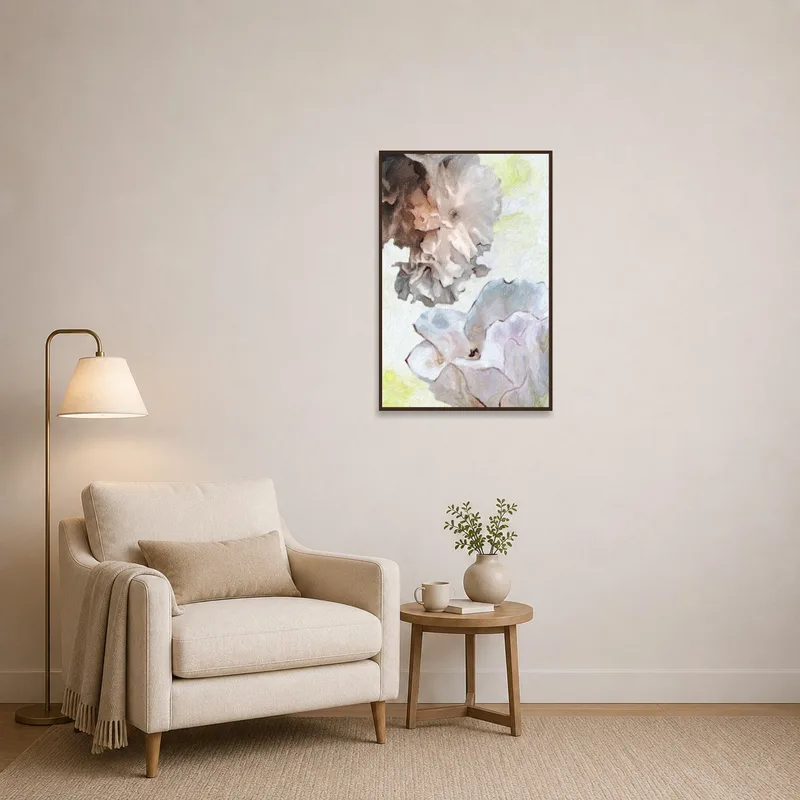 Pastel-toned floral artwork brings a calming effect to a cozy reading corner with a plush chair.