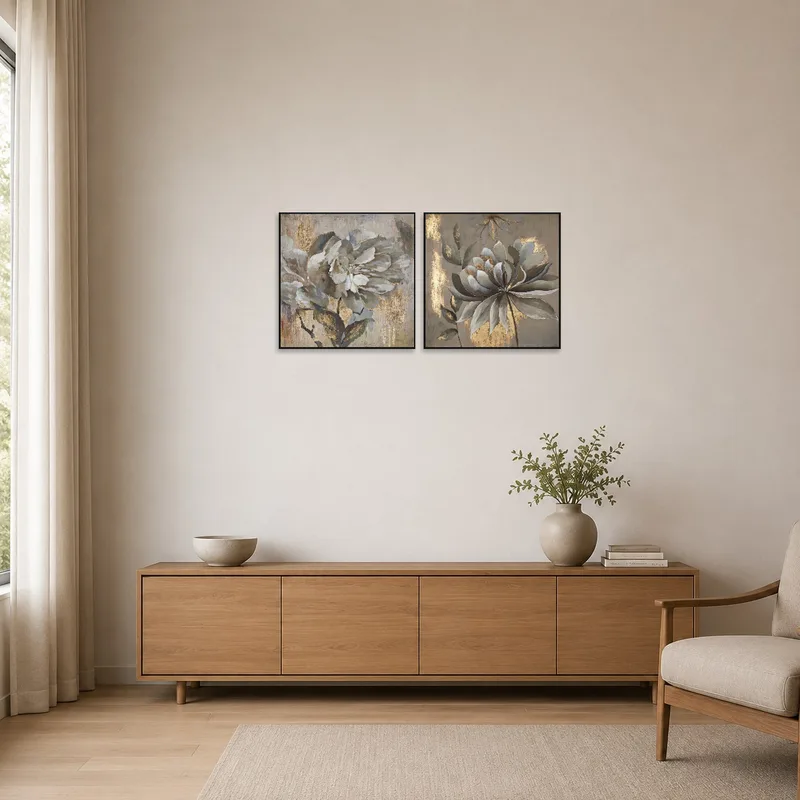 Floral art pair with gold details in a minimalist room.