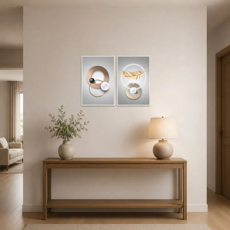 Elegant art set with geometric and feather motifs welcomes guests in the entrance hall.