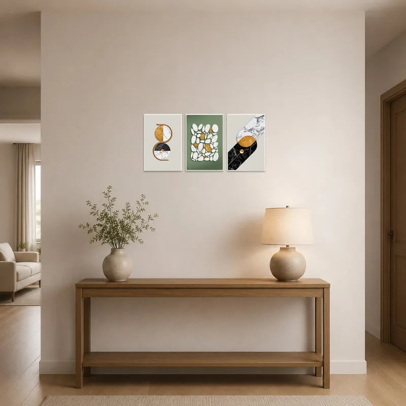 Geometric and marble triptych displayed in a modern entrance hall.