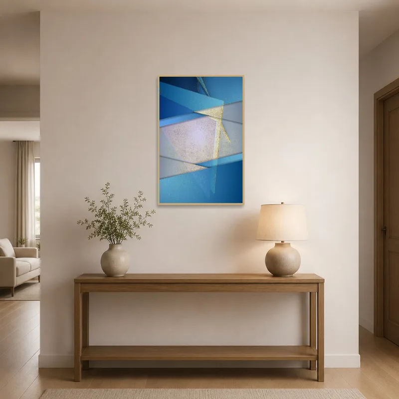 Stylish blue and gold abstract art welcomes guests in an elegant entrance hall.