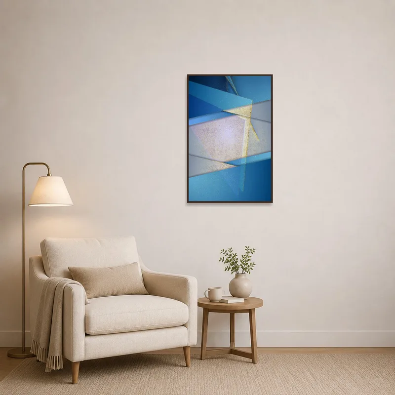 Blue and gold abstract art creates a serene vibe in a cozy reading corner.