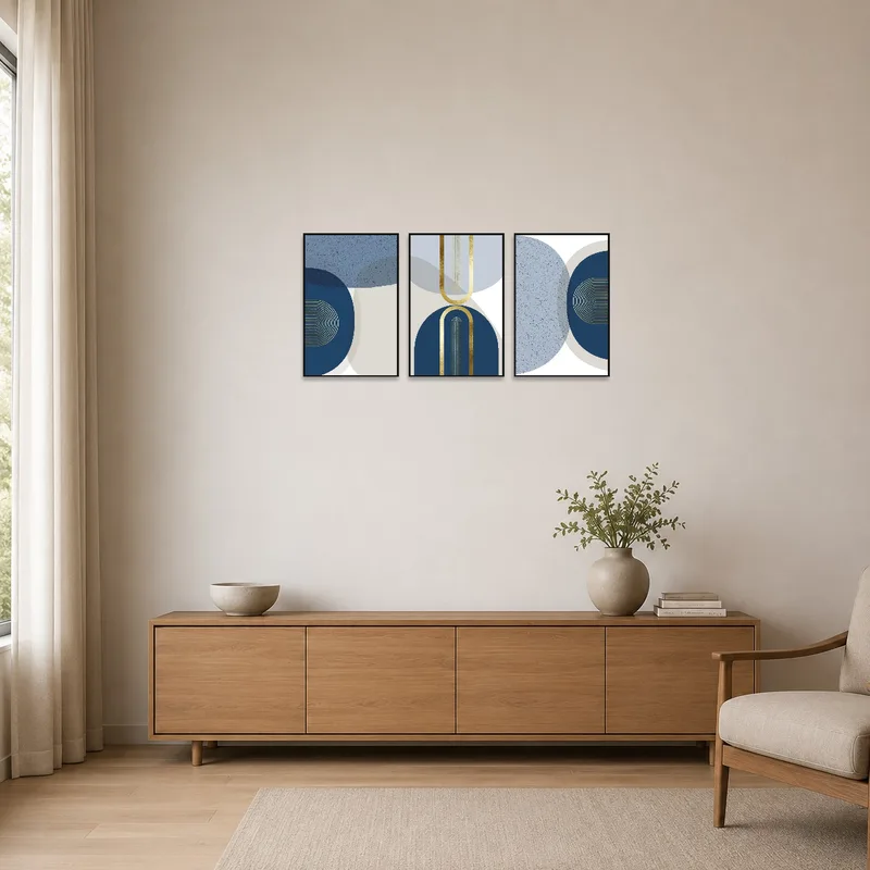 Blue and gold geometric triptych set on a pristine white wall in a minimalist setting.