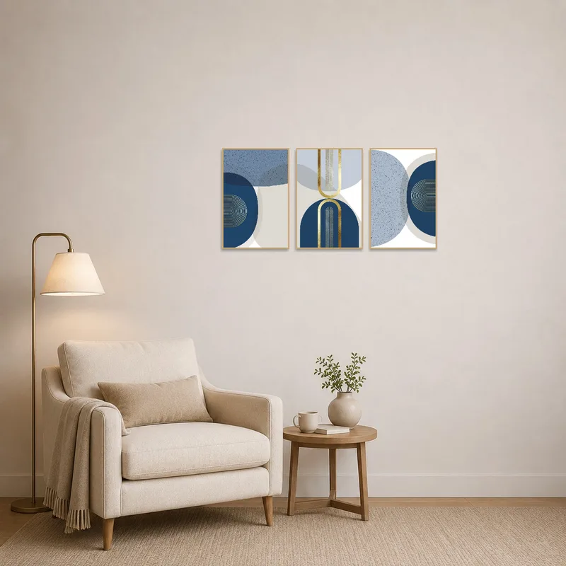 Geometric blue and gold artwork complements a cozy reading nook with an armchair.