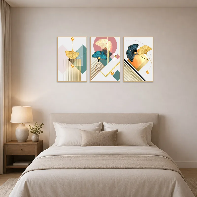 Bedroom wall adorned with geometric ginkgo triptych for a calming effect.