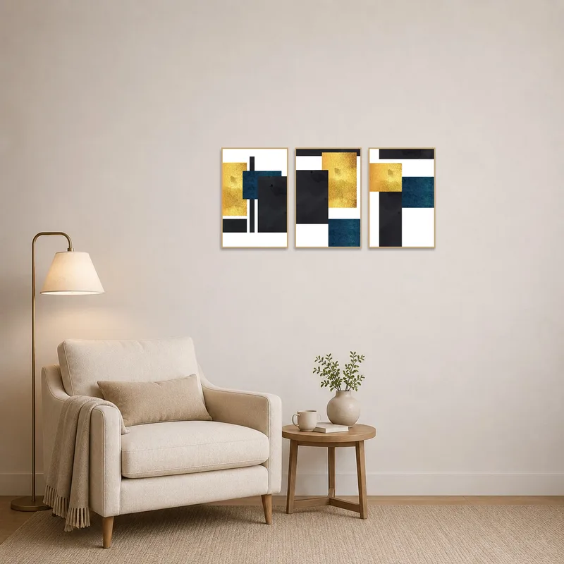 Cozy reading corner accented by a gold and blue geometric triptych.