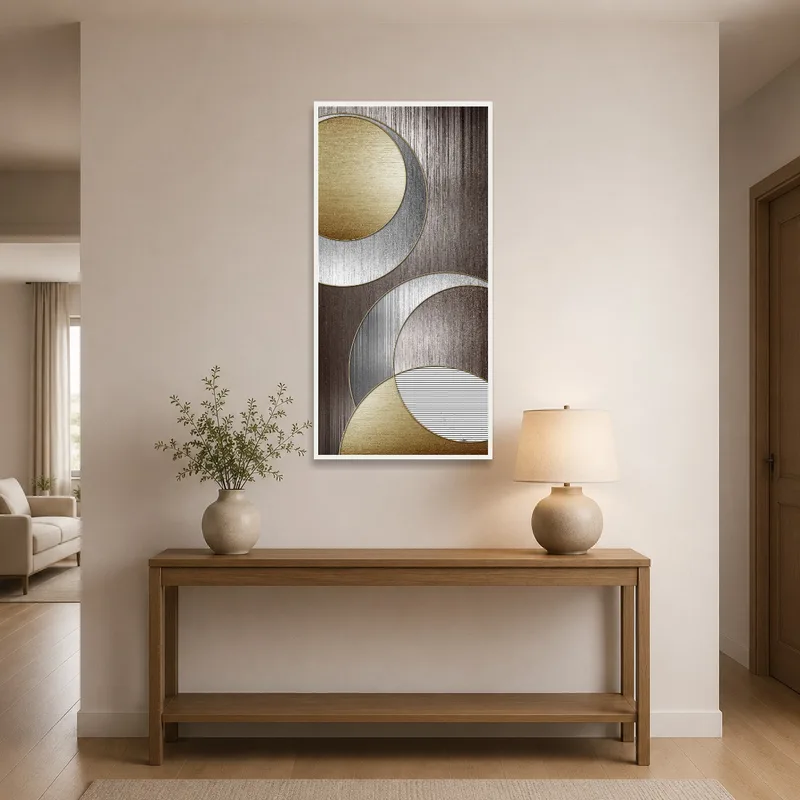 Elegant geometric metallic circles art print hanging in an entrance hall area.