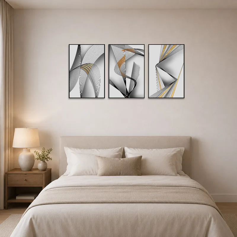 Elegant black and gold triptych complements a calm and serene bedroom ambiance.
