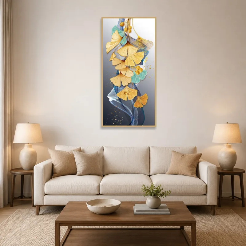 Elegant artwork of ginkgo leaves with abstract accents displayed above a stylish living room sofa.