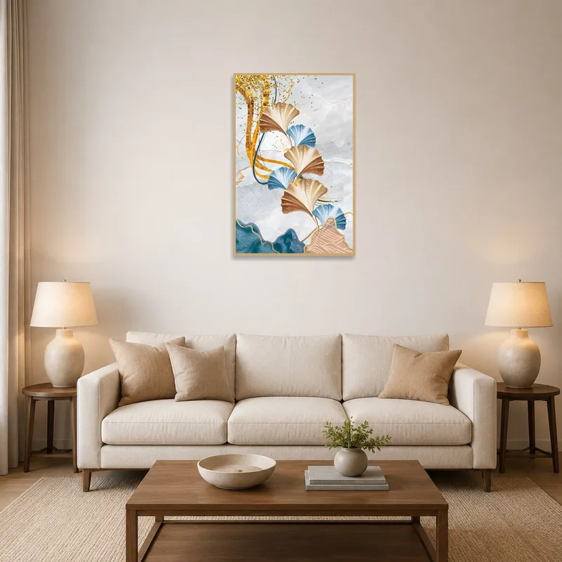 Elegant Ginkgo leaves art with gold accents in a cozy living room above a brown leather sofa.