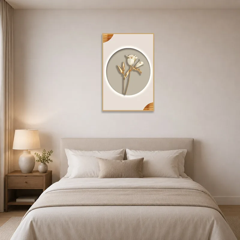 Elegant floral print in gold and beige hanging above a bed in a serene bedroom.